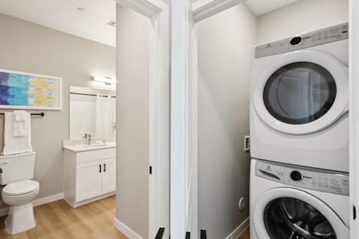 A white washing machine in a laundry room at Ironwood Ranch Apartments,Maricopa