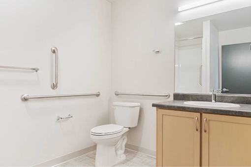 Bathroom with white toilet at Bridge Meadows Redmond Apartments, Oregon