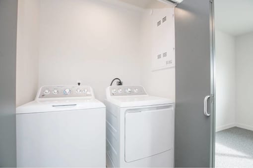 White washing machine at Bridge Meadows Redmond Apartments, Oregon, 97756