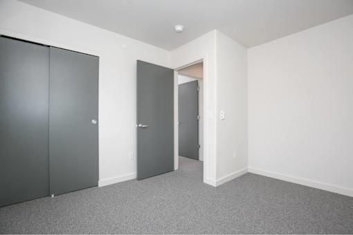 Room with grey carpet at Bridge Meadows Redmond Apartments, Redmond
