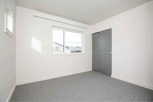 Room with grey door at Bridge Meadows Redmond Apartments, Redmond, Oregon