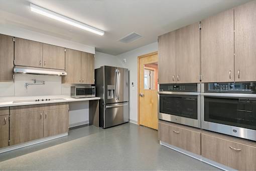 Kitchen with stainless steel appliances at Bridge Meadows Redmond Apartments, Redmond