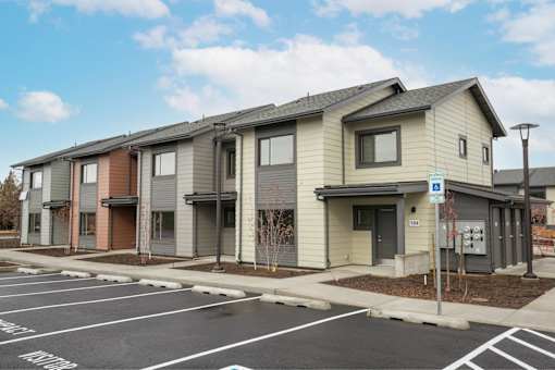 Row of houses with parking at Bridge Meadows Redmond Apartments, Oregon, 97756