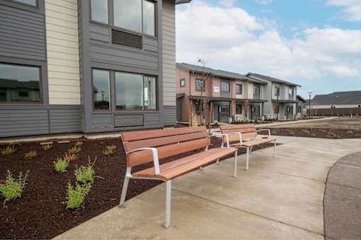 Row of benches at Bridge Meadows Redmond Apartments, Redmond, Oregon