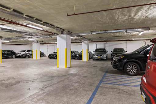 A parking garage with cars parked in it.
