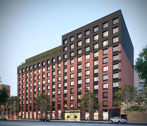 A red brick building with a black top and a green roof.