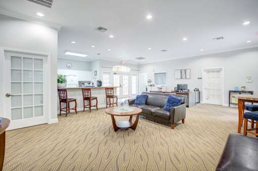 Living Room with Patterned Carpet at PALMETTO RIDGE Apartments, Florida, 32960