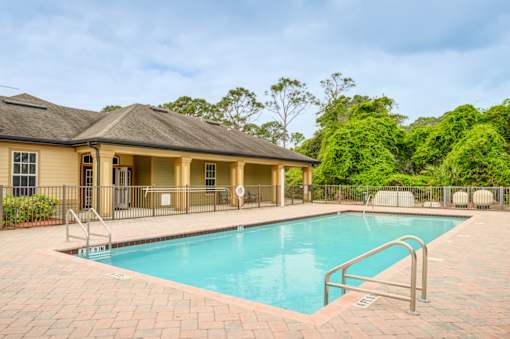 Blue Cool Swimming Pool at PALMETTO RIDGE Apartments, TITUSVILLE, Florida