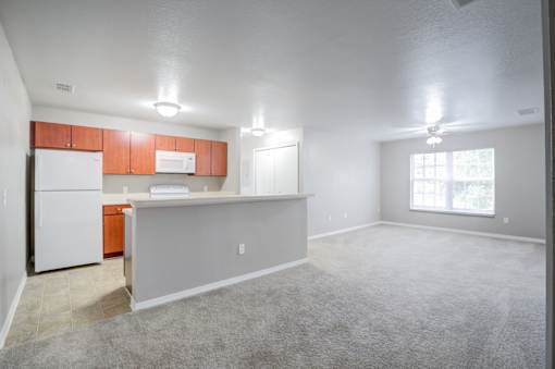 Kitchen with White Appliances at PALMETTO RIDGE Apartments, TITUSVILLE