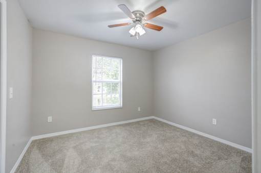 Room with a Ceiling Fan at PALMETTO RIDGE Apartments, Florida, 32960