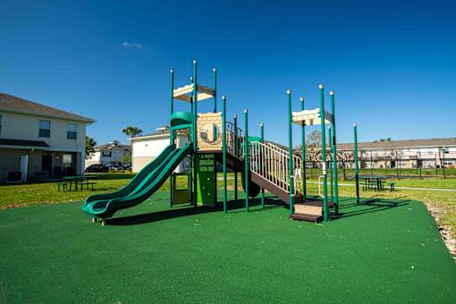 Playground with a Green Slide at THE PALMS AT VERO BEACH, Florida, 32960