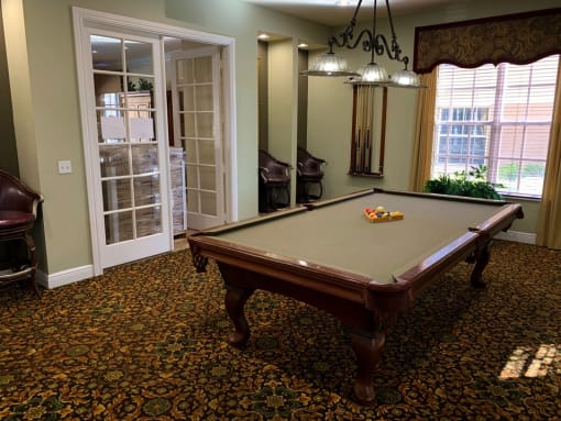 Portofino Apartments game room with pool table at Portofino, Palm Springs, Florida