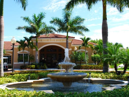 Renaissance community exterior with palm trees and fountain