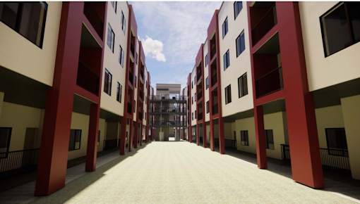 A long corridor with red and white buildings on either side at Vintage at Lockwood Apartments, Oxnard