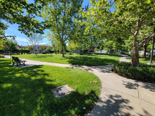 Nicely landscaped grounds with bench seating at DOVER WOODS SENIOR APARTMENTS, California
