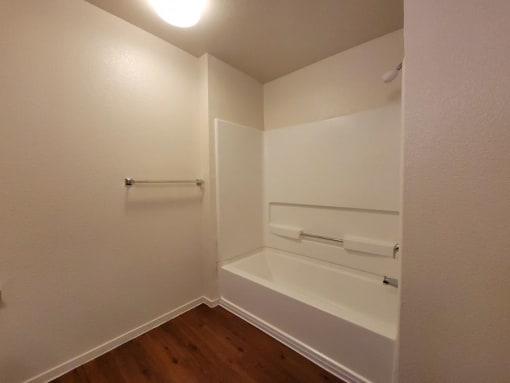 large bathroom with tub at DOVER WOODS SENIOR APARTMENTS, California