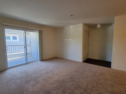 Living area with balcony pace at DOVER WOODS SENIOR APARTMENTS, Fairfield, CA