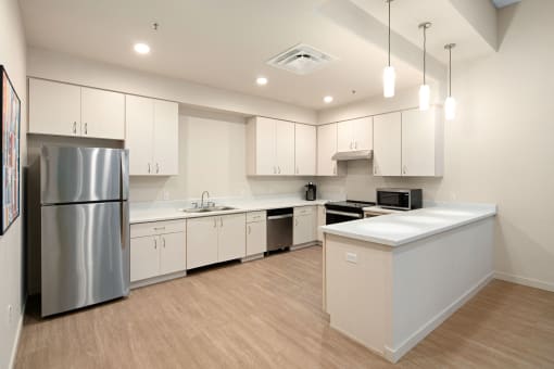 Community Lounge Kitchen - Large white kitchen