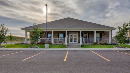 Office building exterior view with parking at Salish Flats APARTMENTS, Airway Heights