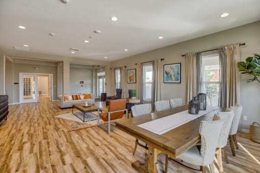 Apartments in Airway Heights for Rent - Salish Flats - Office Area with Meeting Table, Seating Area, Spacious Windows, and Coffee Table at Salish Flats APARTMENTS, Washington