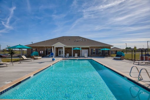 Apartments in Airway Heights for Rent - Salish Flats - Outdoor Swimming Pool With Cool Water, Lounge Chairs, and Extra Covered Seating at Salish Flats APARTMENTS, Airway Heights, WA