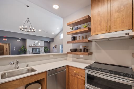 Kitchen area with wooden cabinets at South Peak by Vintage, Reno