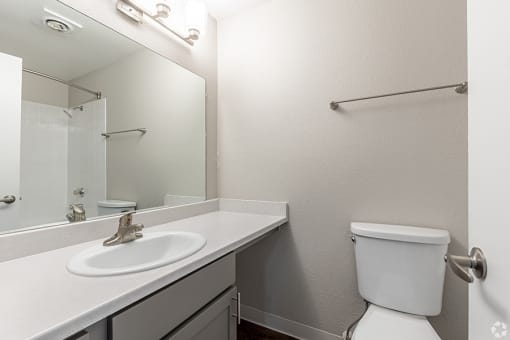 a bathroom with a sink toilet and mirror at Township Eastside, Portland, Oregon
