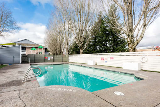Apartments in Gresham OR - Township Eastside - Fenced-In Pool with Concrete Deck at Township Eastside, Oregon