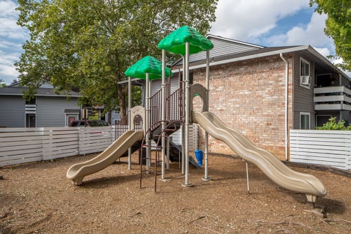 Gresham Apartments - Township Eastside - Playground with Climbing Equipment and Slides at Township Eastside, Portland