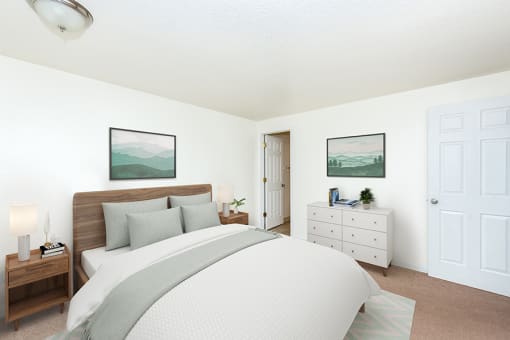 Two-Bedroom Apartments in Gresham, OR- Township Eastside- Large Bed with White Dresser and Wall-to-Wall Carpeting at Township Eastside, Portland, 97236
