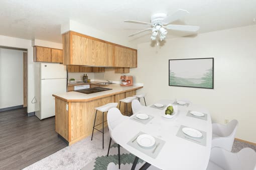 Large Dining Room Table with White Ceiling Fan and Grey Area Rug at Township Eastside, Portland, OR, 06489