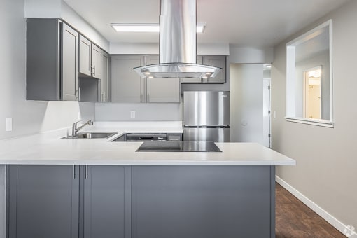 Two BR Apartments in Portland OR - Township Eastside - Kitchen with Grey Cabinets, White Countertops, and Stainless Steel Appliances at Township Eastside, Portland, OR, 06489