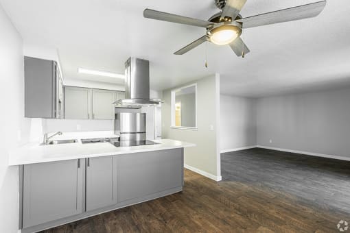 a kitchen and living room with a ceiling fan at Township Eastside, Portland, OR