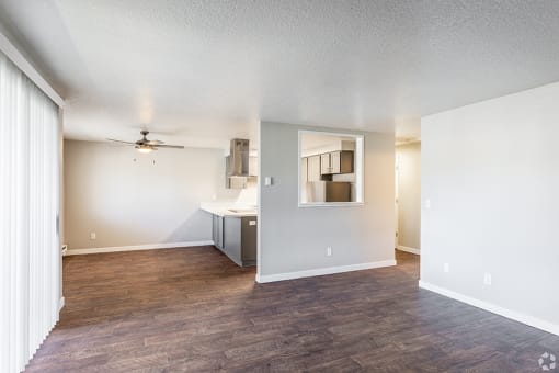 an empty living room with a ceiling fan at Township Eastside, Portland, Oregon