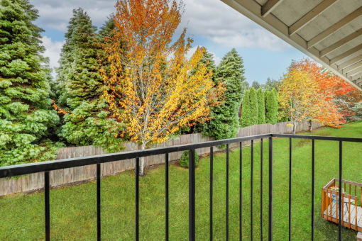 Township Sherwood Exterior balcony, lush landscaping, fall foliage