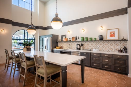 a kitchen with a white table and chairs and a counter top at Vintage at Anacapa Canyon, California
