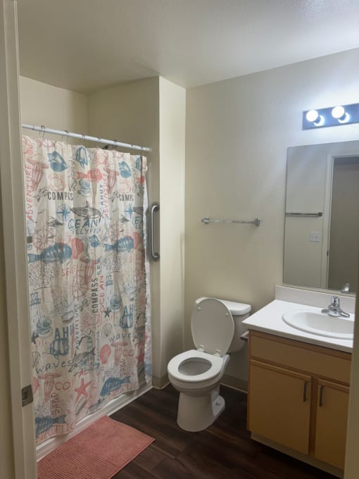 a bathroom with a shower toilet and sink at VINTAGE AT CITI VISTA, Reno, 89512