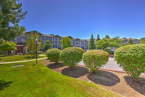 Landscape with Building at VINTAGE AT HOLLY VILLAGE SENIORS Apartments, Everett, WA