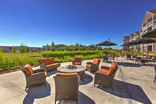 Outdoor seating fir pit at VINTAGE AT LAKEWOOD SENIORS Apartments, Washington, 98271