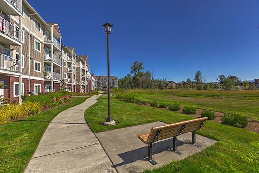 Bench with Buliding View at VINTAGE AT LAKEWOOD SENIORS Apartments, Marysville, Washington, 98271