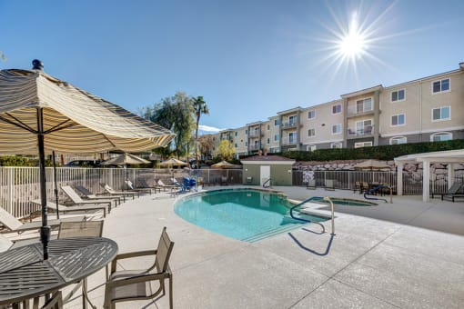 Pool With Relaxing Chairs at VINTAGE AT SEVEN HILLS 55+ COMMUNITY, Henderson Nevada