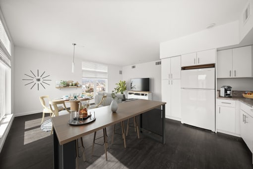 a kitchen and dining area with a table and chairs at Grand and Linden Family Apartments, California