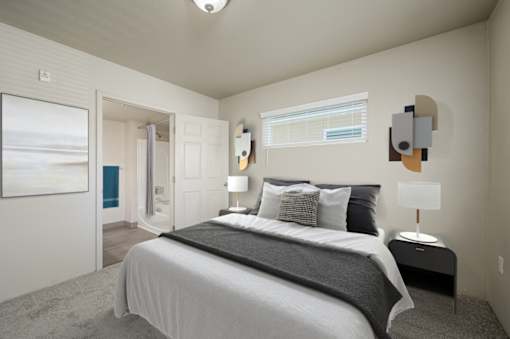 A bedroom with a large bed and a painting on the wall at VISTA CREEK Apartments, Nevada, 89029