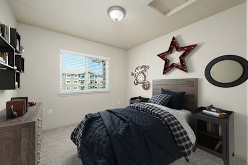 A bedroom with a bed, a dresser, and a window with blinds at VISTA CREEK Apartments, Nevada