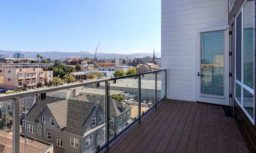 A balcony with a view of a cityscape.