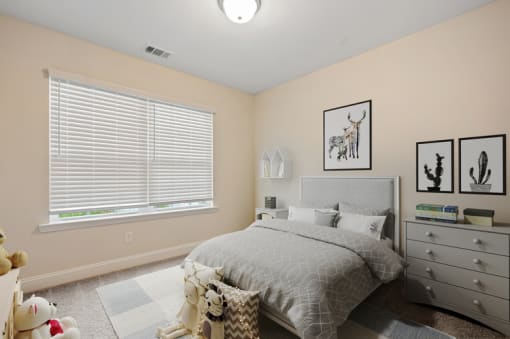 Omnia at Richmond Hill Townhomes in Georgia photo of a bedroom with a bed and a large window