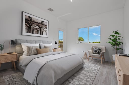 a bedroom with a large bed and a window