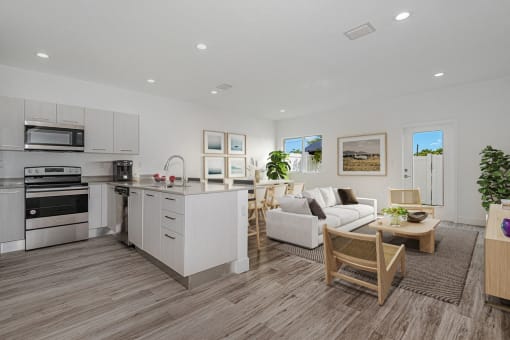 a living room with a kitchen and a dining room