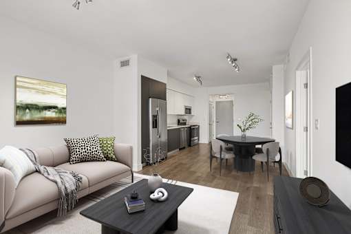 Spacious living area at MB Station apartments featuring modern finishes, abundant natural light, and a comfortable open floor plan near Coral Gables and Downtown Miami.