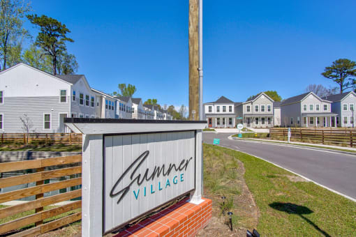 the preserve sign with houses in the background